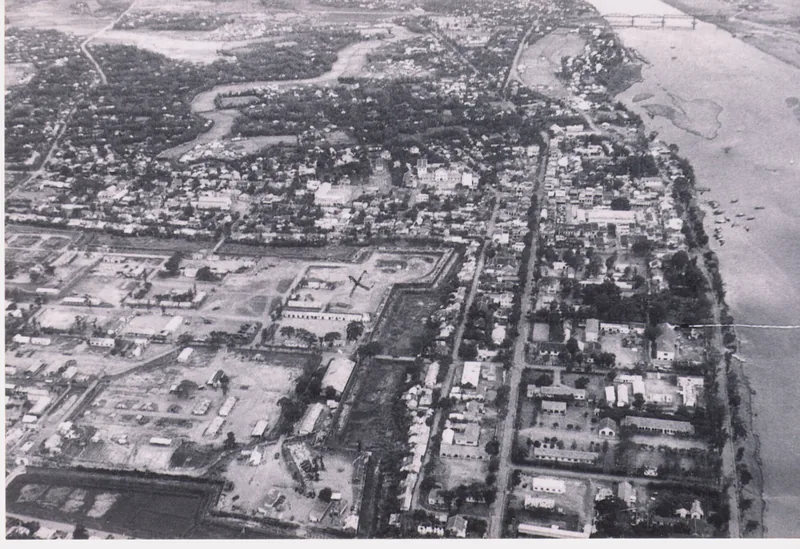 Vintage black-and-white aerial view of Quang Tri Citadel and the surrounding city along a river