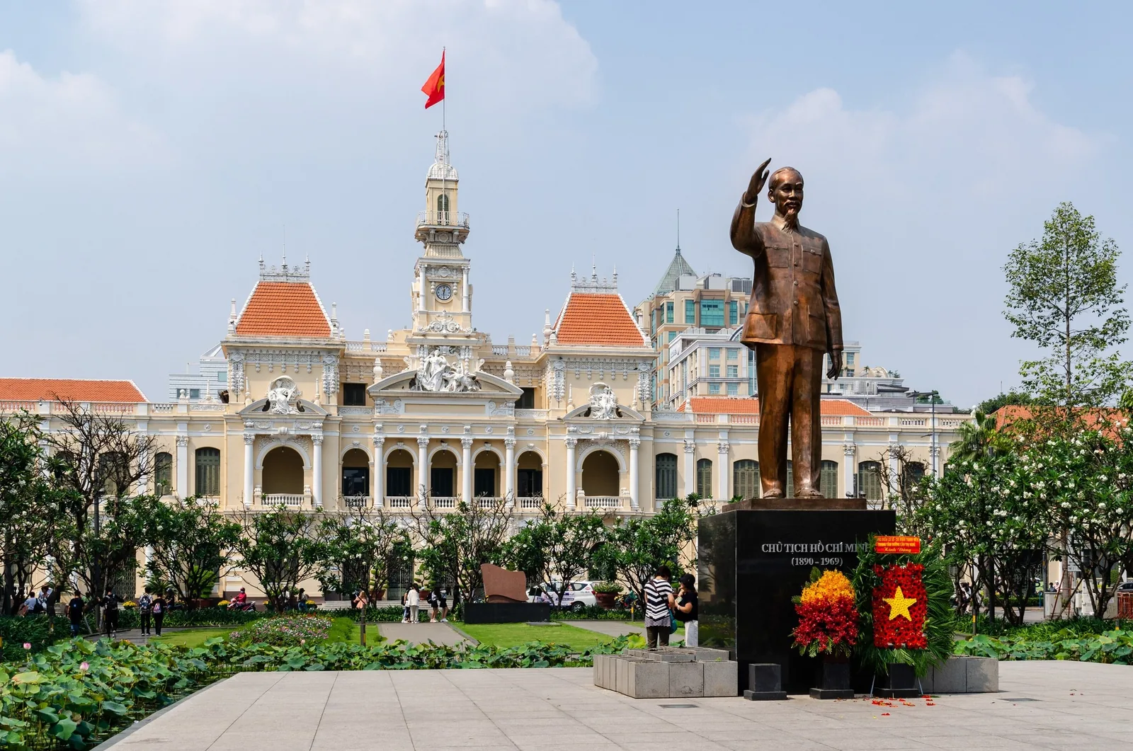 A bronze statue of Ho Chi Minh stands before the colonial-era City Hall in Ho Chi Minh City.