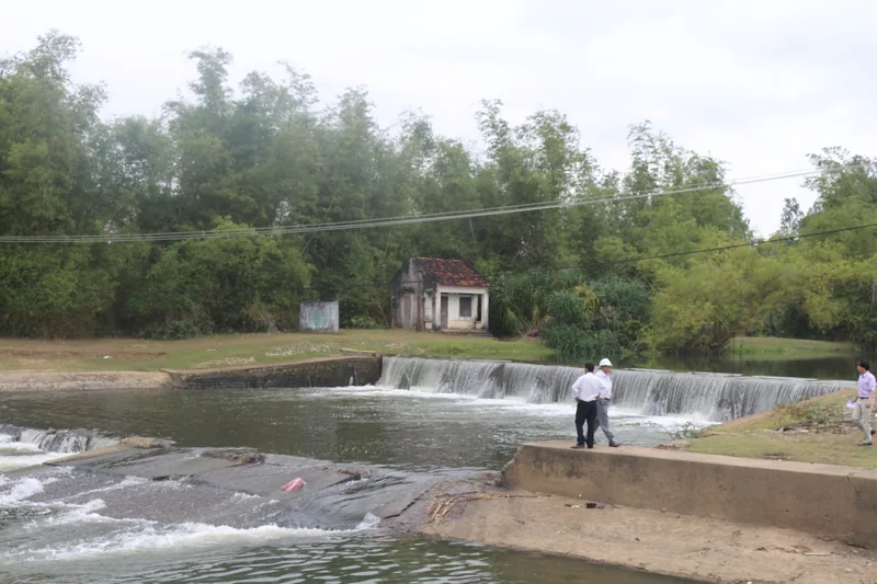 A small weir with a spillway and old brick shed near Phuoc Hoa, in the countryside outside Quy Nhon.