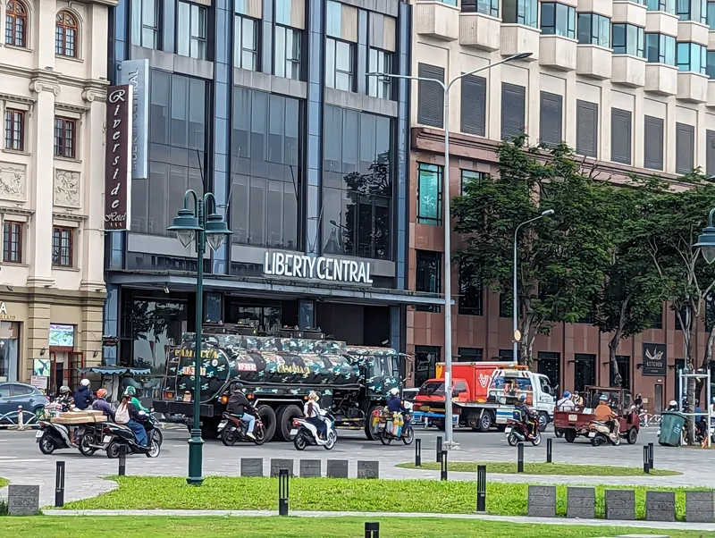 Traffic passes buildings including Liberty Central hotel along Bach Dang Quay in Ho Chi Minh City.