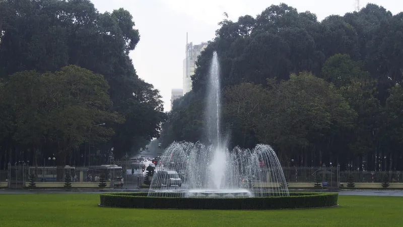 A fountain sprays water on the lawn in front of Independence Palace grounds in Ho Chi Minh City.