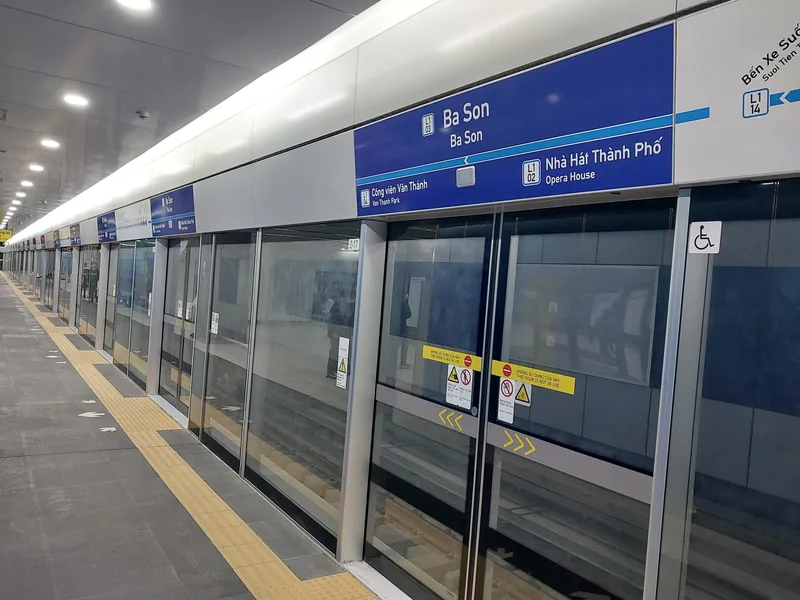 Platform with glass safety doors at Ba Son metro station in Ho Chi Minh City.